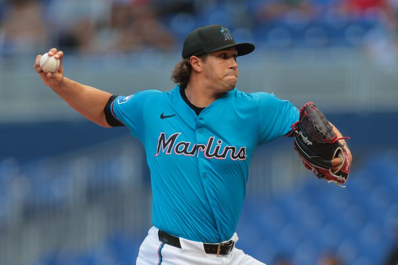 Apr 13, 2025; Miami, Florida, USA; Miami Marlins relief pitcher Tyler Phillips (30) delivers a pitch against the Washington Nationals during the ninth inning at loanDepot Park. Mandatory Credit: Sam Navarro-Imagn Images