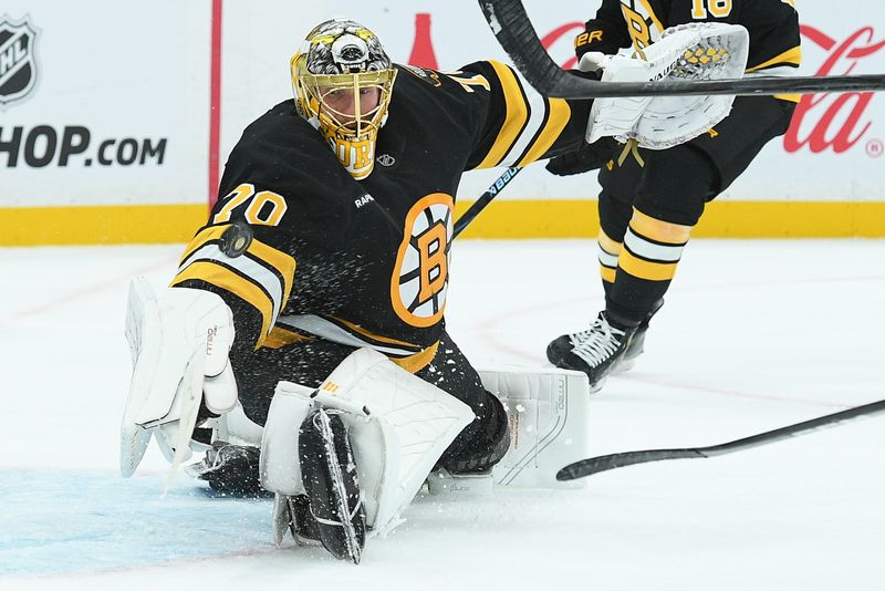 Oct 9, 2025; Boston, Massachusetts, USA; Boston Bruins goaltender Joonas Korpisalo (70) makes a save during overtime against the Chicago Blackhawks at TD Garden. Mandatory Credit: Bob DeChiara-Imagn Images