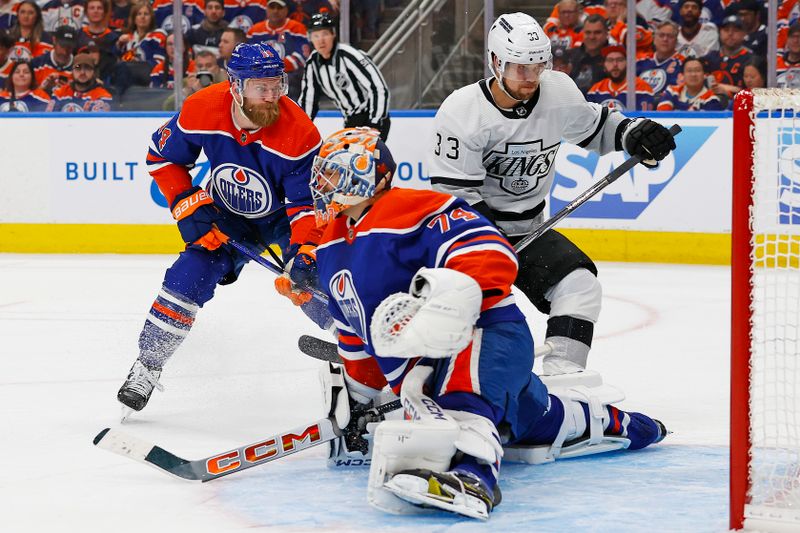 Apr 22, 2024; Edmonton, Alberta, CAN; Edmonton Oilers goaltender Stuart Skinner (74) stretches to makes a save on Los Angeles Kings forward Viktor Arvidsson (33) during the second period in game one of the first round of the 2024 Stanley Cup Playoffs at Rogers Place. Mandatory Credit: Perry Nelson-USA TODAY Sports