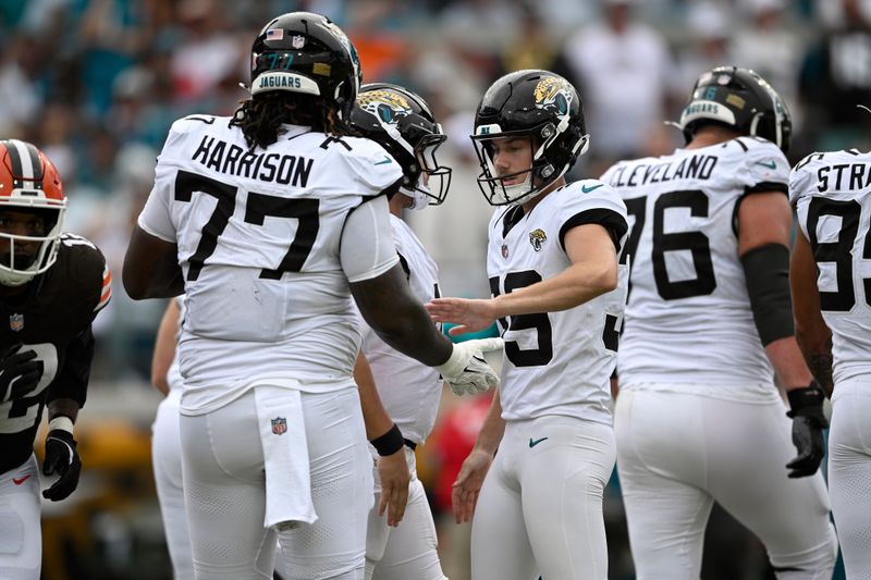 Jacksonville Jaguars place kicker Cam Little (39) celebrates his field goal against the Cleveland Browns with teammates, including offensive tackle Anton Harrison (77) during the first half of an NFL football game Sunday, Sept. 15, 2024, in Jacksonville, Fla. (AP Photo/Phelan M. Ebenhack)