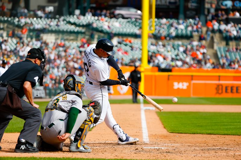 Apr 7, 2024; Detroit, Michigan, USA; Detroit Tigers first baseman Spencer Torkelson (20) hits the ball during an at bat during the game against the Oakland Athletics at Comerica Park. Mandatory Credit: Brian Bradshaw Sevald-USA TODAY Sports