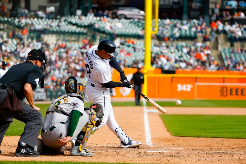 Apr 7, 2024; Detroit, Michigan, USA; Detroit Tigers first baseman Spencer Torkelson (20) hits the ball during an at bat during the game against the Oakland Athletics at Comerica Park. Mandatory Credit: Brian Bradshaw Sevald-USA TODAY Sports