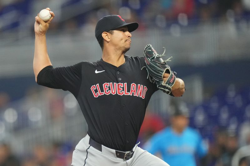Jun 9, 2024; Miami, Florida, USA; Miami Marlins starting pitcher Trevor Rogers (28) pitches against the Cleveland Guardians in the first inning at loanDepot Park. Mandatory Credit: Jim Rassol-USA TODAY Sports