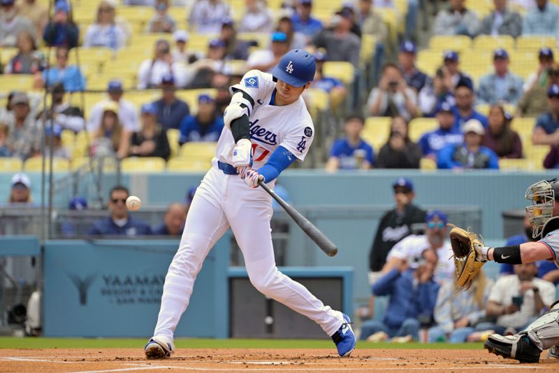 Apr 30, 2025; Los Angeles, California, USA; Los Angeles Dodgers designated hitter Shohei Ohtani (17) flies out against the Miami Marlins during the first inning at Dodger Stadium. Mandatory Credit: Jayne Kamin-Oncea-Imagn Images