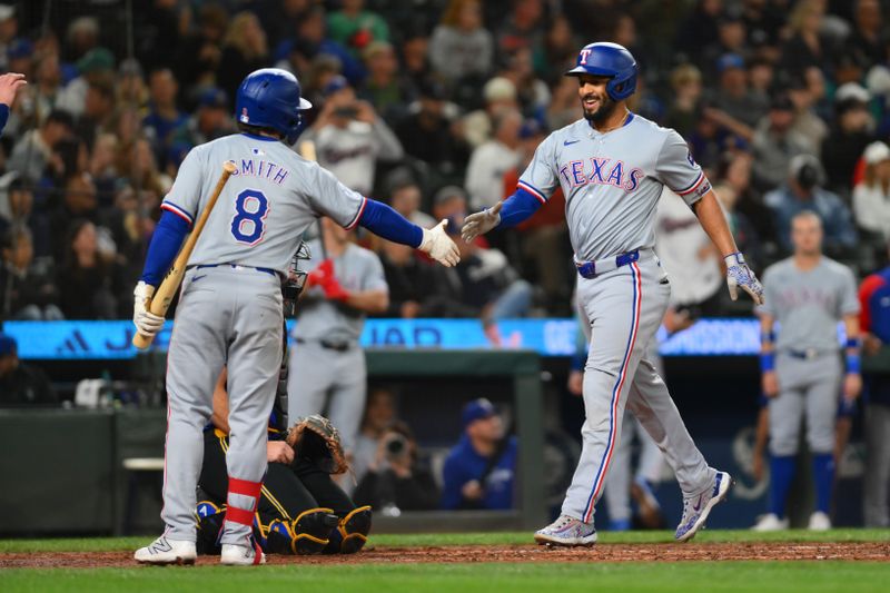 Sep 14, 2024; Seattle, Washington, USA; Texas Rangers shortstop Josh Smith (8) and second baseman Marcus Semien (2) celebrate after Semien hit a 2-run home run against the Seattle Mariners during the fifth inning at T-Mobile Park. Mandatory Credit: Steven Bisig-Imagn Images