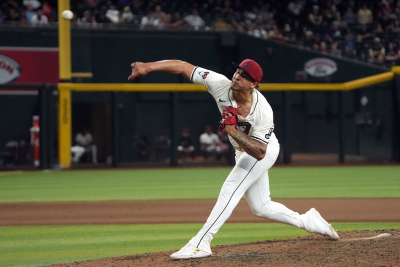 Jul 8, 2024; Phoenix, Arizona, USA; Arizona Diamondbacks pitcher Justin Martinez (63) throws against the Atlanta Braves in the eleventh inning at Chase Field. Mandatory Credit: Rick Scuteri-USA TODAY Sports