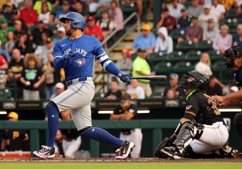 Mar 21, 2024; Bradenton, Florida, USA; Toronto Blue Jays right fielder George Springer (4) singles during the third inning against the Pittsburgh Pirates  at LECOM Park. Mandatory Credit: Kim Klement Neitzel-USA TODAY Sports