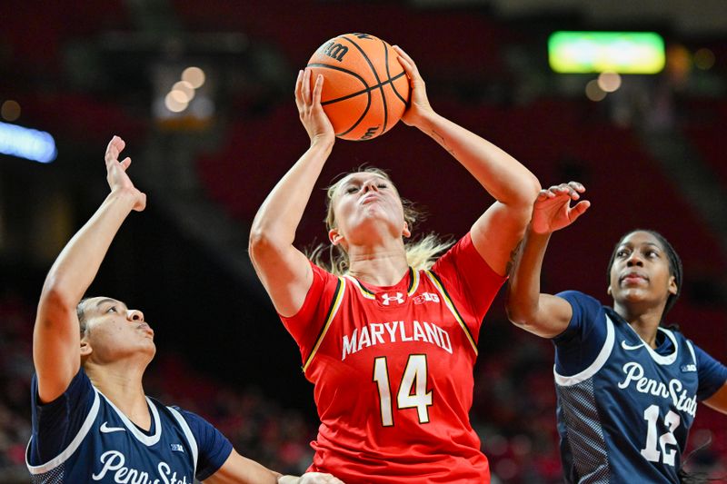 Feb 18, 2024; College Park, Maryland, USA;  Maryland Terrapins forward Allie Kubek (14) shoots in-between Penn State Nittany Lions guard Jayla Oden (12) and  guard Jayla Oden (12) during the second  half at Xfinity Center. Mandatory Credit: Tommy Gilligan-USA TODAY Sports