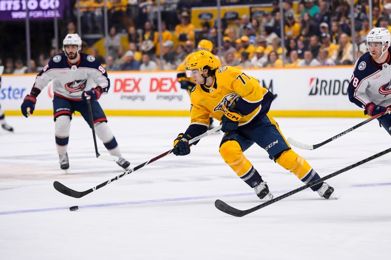 Apr 13, 2024; Nashville, Tennessee, USA; Nashville Predators right wing Luke Evangelista (77) skates against the Columbus Blue Jackets during the first period at Bridgestone Arena. Mandatory Credit: Steve Roberts-USA TODAY Sports