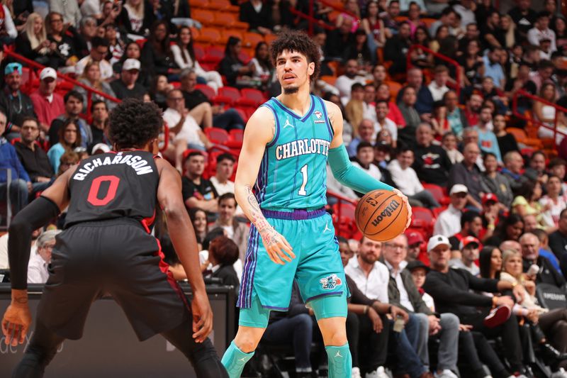 MIAMI, FL - JANUARY 14: LaMelo Ball #1 of the Charlotte Hornets looks on during the game against the Miami Heat on January 14, 2024 at Kaseya Center in Miami, Florida. NOTE TO USER: User expressly acknowledges and agrees that, by downloading and or using this Photograph, user is consenting to the terms and conditions of the Getty Images License Agreement. Mandatory Copyright Notice: Copyright 2024 NBAE (Photo by Issac Baldizon/NBAE via Getty Images)