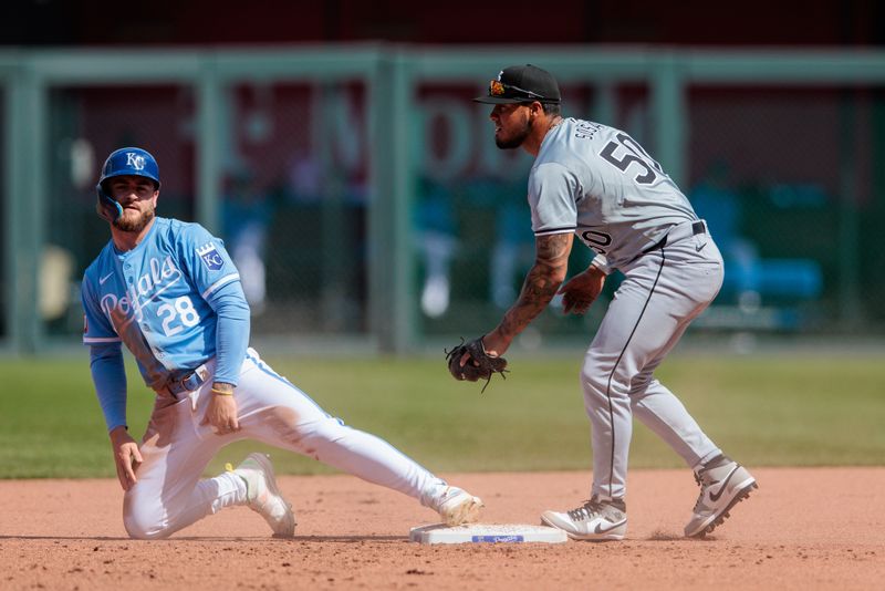 Apr 7, 2024; Kansas City, Missouri, USA; Kansas City Royals outfielder Kyle Isbel (28) after stealing 2nd base around Chicago White Sox second base Lenyn Sosa (50) during the eighth inning at Kauffman Stadium. Mandatory Credit: William Purnell-USA TODAY Sports