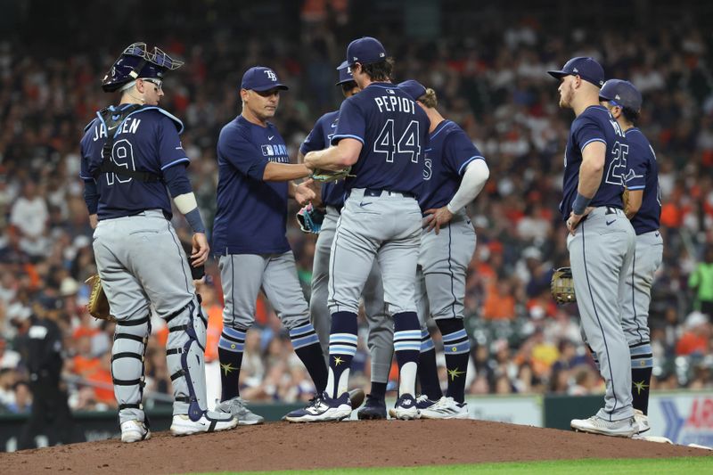 May 30, 2025; Houston, Texas, USA; Tampa Bay Rays manager Kevin Cash (16) takes the ball from starting pitcher Ryan Pepiot (44) during a pitching change in the seventh inning against the Houston Astros at Daikin Park. Mandatory Credit: Troy Taormina-Imagn Images