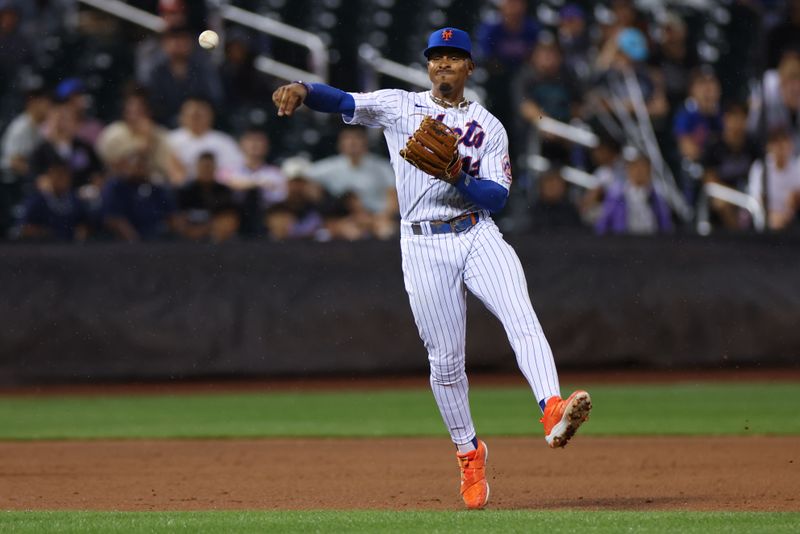 Jun 27, 2023; New York City, New York, USA; New York Mets shortstop Francisco Lindor (12) throws the ball to first base for an out during the eighth inning against the Milwaukee Brewers  at Citi Field. Mandatory Credit: Vincent Carchietta-USA TODAY Sports