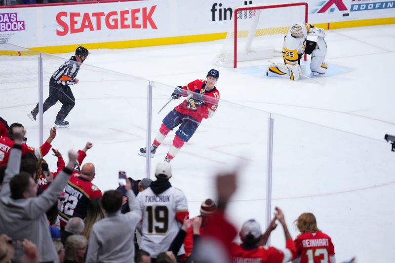 Jan 3, 2025; Sunrise, Florida, USA; Florida Panthers center Anton Lundell (15) celebrates after scoring the winning goal against the Pittsburgh Penguins during a shootout at Amerant Bank Arena. Mandatory Credit: Rich Storry-Imagn Images