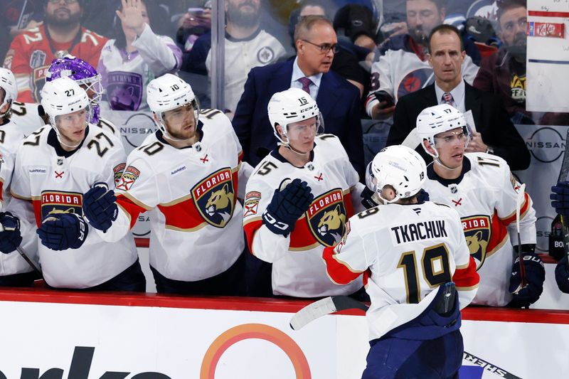 Nov 19, 2024; Winnipeg, Manitoba, CAN; Florida Panthers left wing Matthew Tkachuk (19) celebrates his third period goal against the Winnipeg Jets at Canada Life Centre. Mandatory Credit: James Carey Lauder-Imagn Images