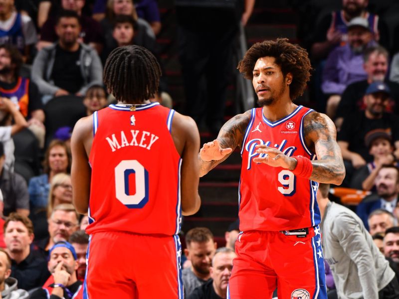 PHOENIX, AZ - MARCH 20: Tyrese Maxey #0 high fives  Kelly Oubre Jr. #9 of the Philadelphia 76ers during the game against the Phoenix Suns on March 20, 2024 at Footprint Center in Phoenix, Arizona. NOTE TO USER: User expressly acknowledges and agrees that, by downloading and or using this photograph, user is consenting to the terms and conditions of the Getty Images License Agreement. Mandatory Copyright Notice: Copyright 2024 NBAE (Photo by Barry Gossage/NBAE via Getty Images)