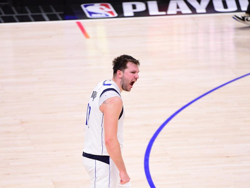 LOS ANGELES, CA - APRIL 23: Luka Doncic #77 of the Dallas Mavericks celebrate during the game against the LA Clippers during Round 1 Game 2 of the 2024 NBA Playoffs on April 23, 2024 at Crypto.Com Arena in Los Angeles, California. NOTE TO USER: User expressly acknowledges and agrees that, by downloading and/or using this Photograph, user is consenting to the terms and conditions of the Getty Images License Agreement. Mandatory Copyright Notice: Copyright 2024 NBAE (Photo by Adam Pantozzi/NBAE via Getty Images)