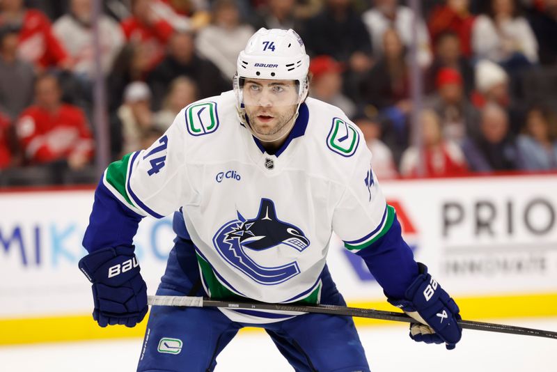 Dec 1, 2024; Detroit, Michigan, USA;  Vancouver Canucks left wing Jake DeBrusk (74) gets set during a face off in the first period against the Detroit Red Wings at Little Caesars Arena. Mandatory Credit: Rick Osentoski-Imagn Images