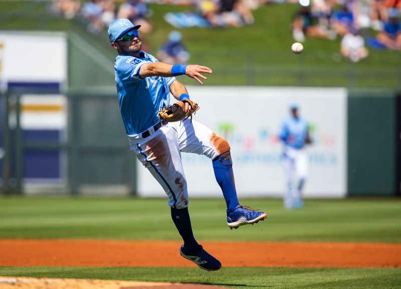 Mar 21, 2024; Surprise, Arizona, USA; Kansas City Royals infielder Garrett Hampson fields a ground ball for an out against the Chicago White Sox during a spring training baseball game at Surprise Stadium. Mandatory Credit: Mark J. Rebilas-USA TODAY Sports