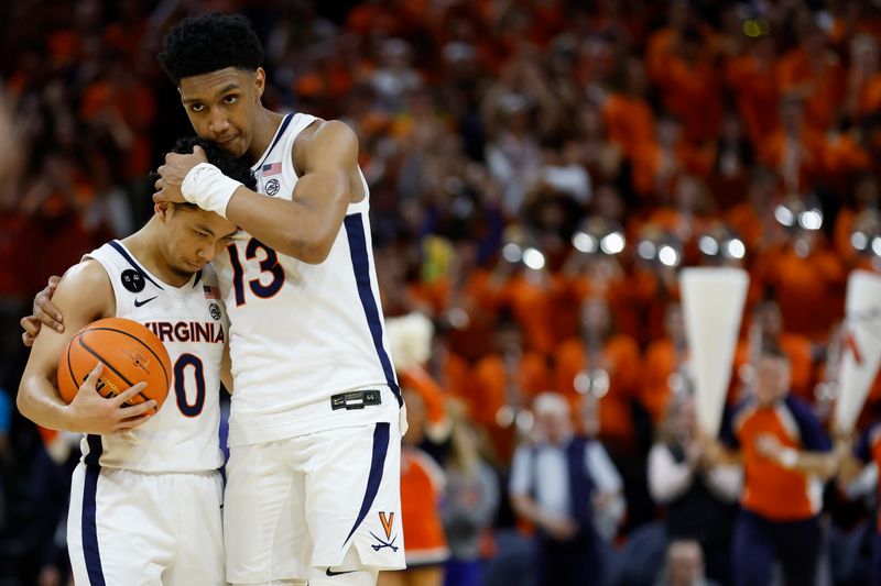 Feb 11, 2023; Charlottesville, Virginia, USA; Virginia Cavaliers guard Kihei Clark (0) celebrates with Cavaliers guard Ryan Dunn (13) after the final horn against the Duke Blue Devils in overtime at John Paul Jones Arena. Mandatory Credit: Geoff Burke-USA TODAY Sports