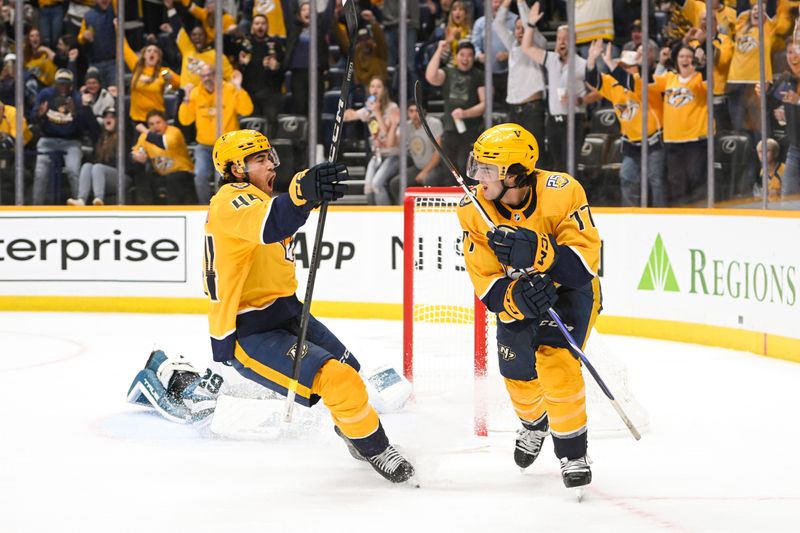 Oct 21, 2023; Nashville, Tennessee, USA;  Nashville Predators left wing Kiefer Sherwood (44) celebrates the goal of right wing Luke Evangelista (77) against the San Jose Sharks   during the third period at Bridgestone Arena. Mandatory Credit: Steve Roberts-USA TODAY Sports