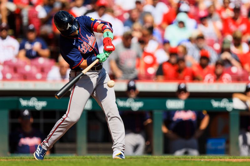 Sep 19, 2024; Cincinnati, Ohio, USA; Atlanta Braves second baseman Whit Merrifield (15) hits a single in the second inning against the Cincinnati Reds at Great American Ball Park. Mandatory Credit: Katie Stratman-Imagn Images