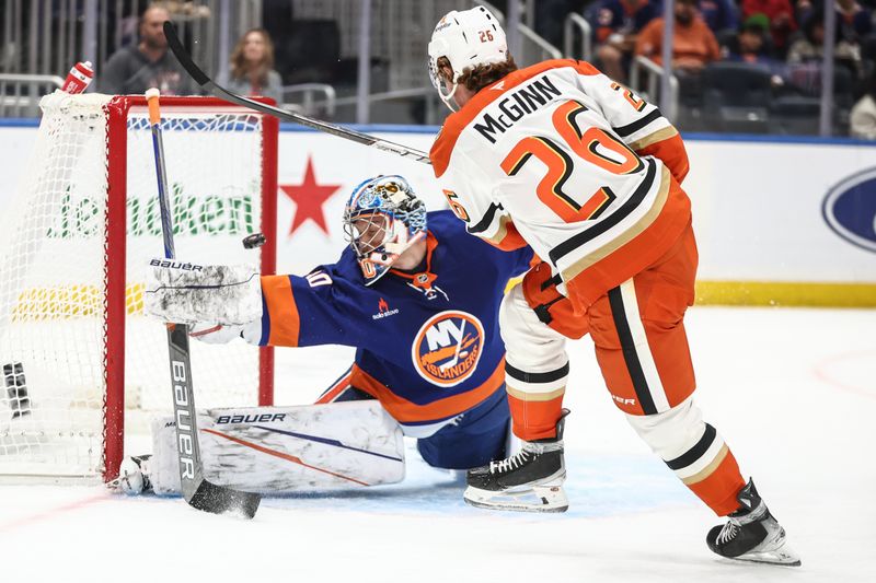 Oct 29, 2024; Elmont, New York, USA; New York Islanders goaltender Ilya Sorokin (30) makes a save on a shot on goal attempt by Anaheim Ducks left wing Brock McGinn (26) in the first period at UBS Arena. Mandatory Credit: Wendell Cruz-Imagn Images