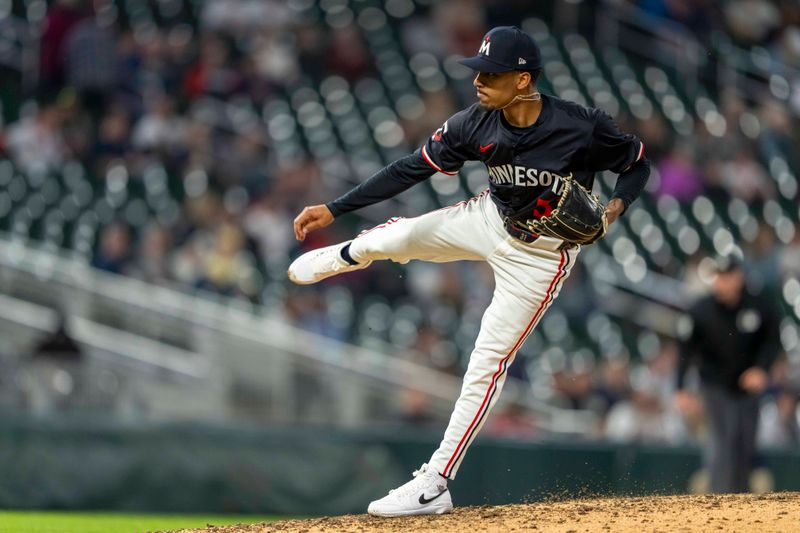 Apr 22, 2024; Minneapolis, Minnesota, USA; Minnesota Twins pitcher Ronny Henriquez (31) delivers a pitch against the Chicago White Sox in the ninth inning at Target Field. Mandatory Credit: Jesse Johnson-USA TODAY Sports