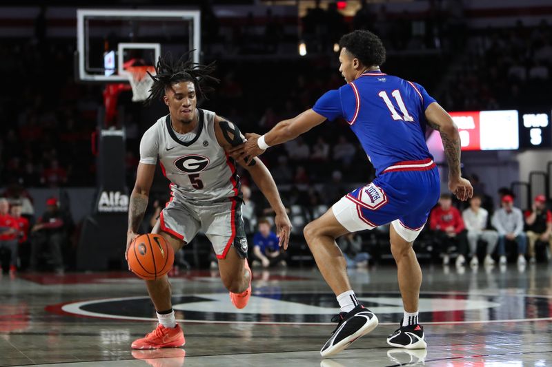 Dec 22, 2025; Athens, Georgia, USA; Georgia Bulldogs guard Jeremiah Wilkinson (5) works past West Georgia Wolves forward Kolten Griffin (11) in the first half at Stegeman Coliseum. Mandatory Credit: Mady Mertens-Imagn Images