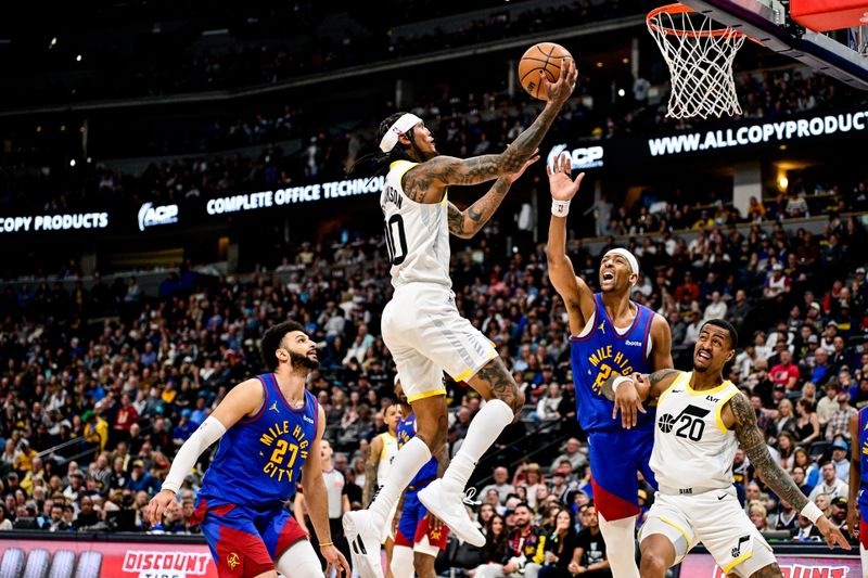 DENVER, COLORADO - MARCH 9: Jordan Clarkson #00 of the Utah Jazz scores on a layup in the second half of a game against the Denver Nuggets at Ball Arena on March 9, 2024 in Denver, Colorado. (Photo by Dustin Bradford/Getty Images)