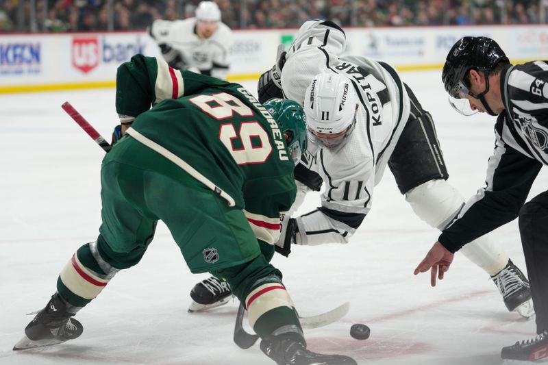 Feb 21, 2023; Saint Paul, Minnesota, USA; Los Angeles Kings center Anze Kopitar (11) faces off against Minnesota Wild center Frederick Gaudreau (89) in the first period at Xcel Energy Center. Mandatory Credit: Matt Blewett-USA TODAY Sports