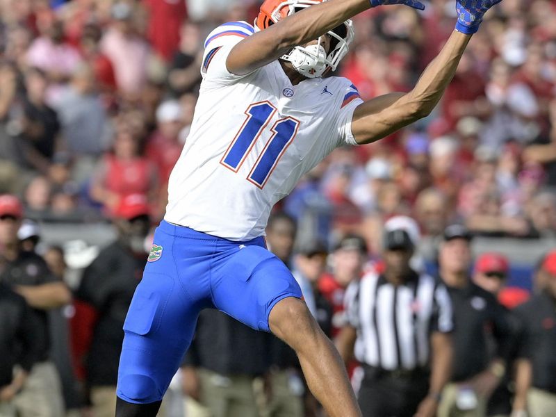 Nov 2, 2024; Jacksonville, Florida, USA; Florida Gators wide receiver Aidan Mizell (11) catches a pass against the Georgia Bulldogs during the first half at EverBank Stadium. Mandatory Credit: Melina Myers-Imagn Images