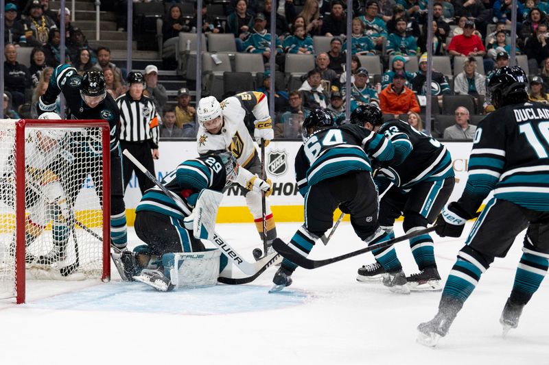 Feb 19, 2024; San Jose, California, USA; Vegas Golden Knights center Byron Froese (51) attempts to shoot the puck against San Jose Sharks goalie Mackenzie Blackwood (29) during the first period at SAP Center at San Jose. Mandatory Credit: Neville E. Guard-USA TODAY Sports