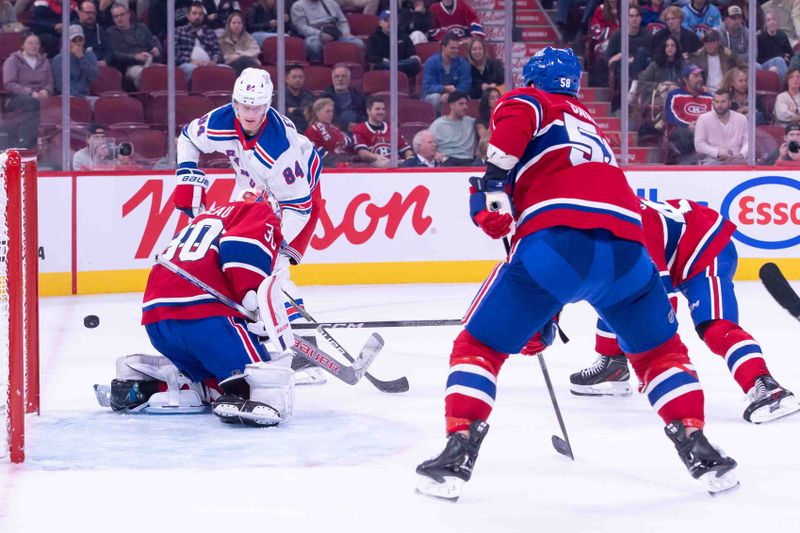 Oct 22, 2024; Ottawa, Ontario, CAN; New York Rangers center Adam Edstrom (84) hits the post on a shot towards Montreal Canadiens goalie Cayden Primeau (30) in the third period at the Bell Centre. Mandatory Credit: Marc DesRosiers-Imagn Images