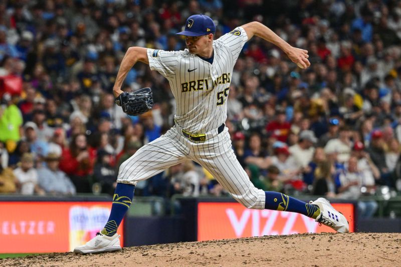 May 11, 2024; Milwaukee, Wisconsin, USA; Milwaukee Brewers pitcher Hoby Milner (55) throws against the St. Louis Cardinals in the seventh inning at American Family Field. Mandatory Credit: Benny Sieu-USA TODAY Sports