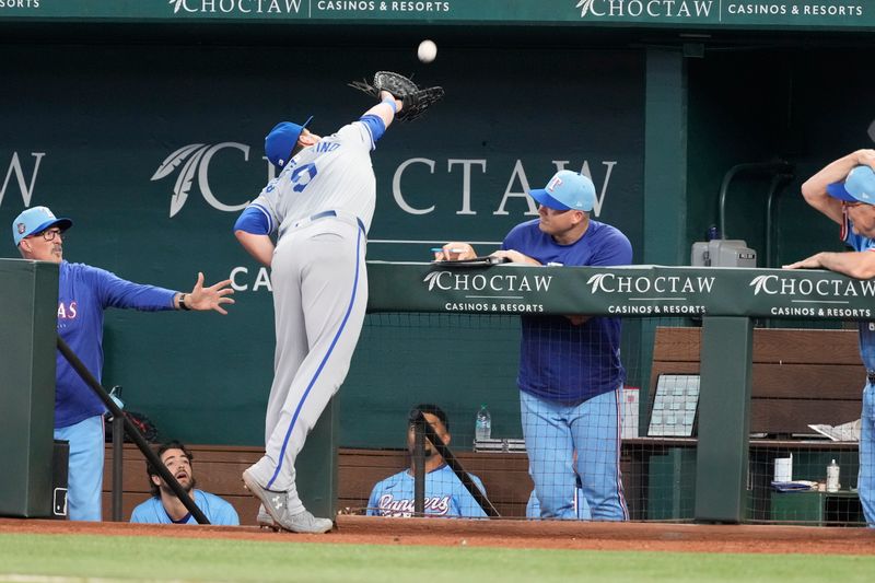 Jun 23, 2024; Arlington, Texas, USA; Kansas City Royals first baseman Vinnie Pasquantino (9) reaches over the Rangers dugout but is unable to catch the foul ball hit by Texas Rangers first baseman Nathaniel Lowe (not shown) during the eighth inning at Globe Life Field. Mandatory Credit: Jim Cowsert-USA TODAY Sports