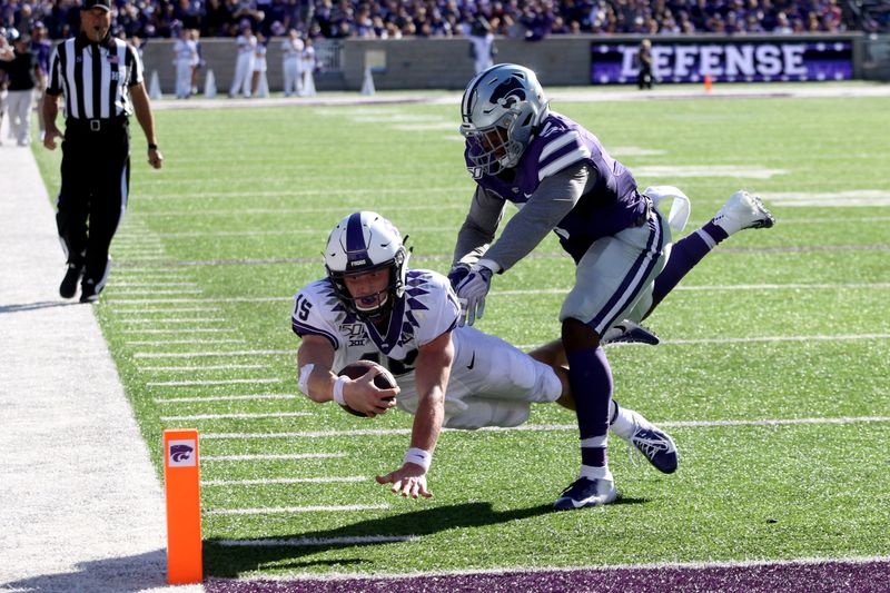 Oct 19, 2019; Manhattan, KS, USA; TCU Horned Frogs quarterback Max Duggan (15) dives for the goal line for a touchdown against Kansas State Wildcats linebacker Da'Quan Patton (5) during the third quarter of a game at Bill Snyder Family Stadium. Mandatory Credit: Scott Sewell-USA TODAY Sports