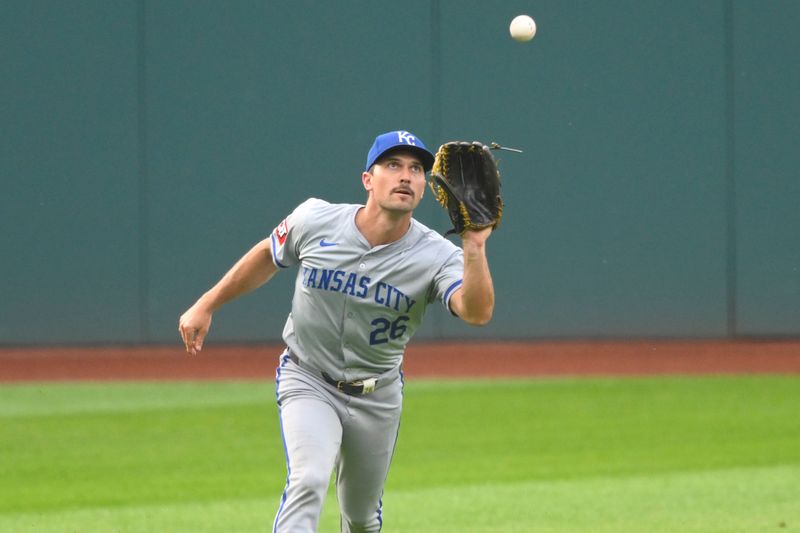 Jun 4, 2024; Cleveland, Ohio, USA; Kansas City Royals left fielder Adam Frazier (26) makes a catch in the first inning against the Cleveland Guardians at Progressive Field. Mandatory Credit: David Richard-USA TODAY Sports