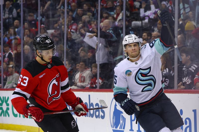 Dec 6, 2024; Newark, New Jersey, USA; Seattle Kraken left wing Andre Burakovsky (95) celebrates his goal against the New Jersey Devils during the first period at Prudential Center. Mandatory Credit: Ed Mulholland-Imagn Images