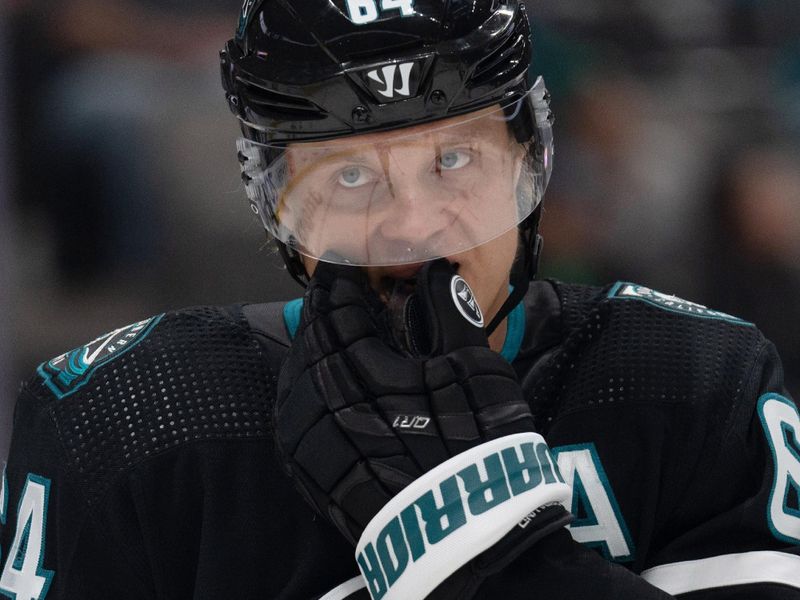 Feb 24, 2024; San Jose, California, USA; San Jose Sharks center Mikael Granlund (64) adjusts his mouthpiece during the first period against the Nashville Predators at SAP Center at San Jose. Mandatory Credit: Stan Szeto-USA TODAY Sports