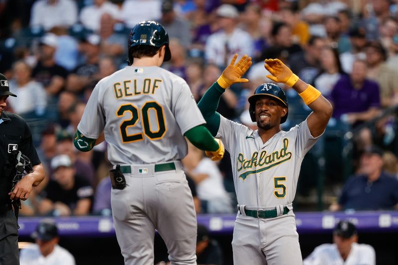 Jul 28, 2023; Denver, Colorado, USA; Oakland Athletics left fielder Tony Kemp (5) celebrates the two run home run of second baseman Zack Gelof (20) in the fifth inning against the Colorado Rockies at Coors Field. Mandatory Credit: Isaiah J. Downing-USA TODAY Sports