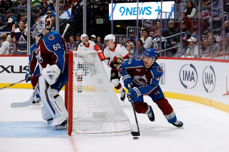 Oct 27, 2024; Denver, Colorado, USA; Colorado Avalanche defenseman Samuel Girard (49) controls the puck behind goaltender Justus Annunen (60) in the first period against the Ottawa Senators at Ball Arena. Mandatory Credit: Isaiah J. Downing-Imagn Images