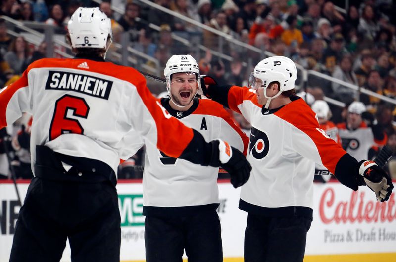 Feb 25, 2024; Pittsburgh, Pennsylvania, USA;  Philadelphia Flyers defenseman Travis Sanheim (6) and defenseman Cam York (8) congratulate center Scott Laughton (21) after Laughton scored a goal against the Pittsburgh Penguins during the first period at PPG Paints Arena. Mandatory Credit: Charles LeClaire-USA TODAY Sports