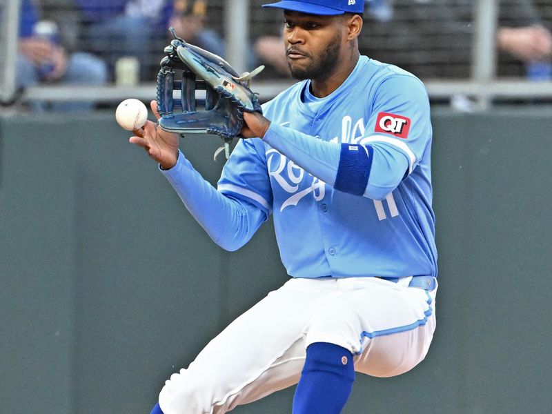 Apr 25, 2024; Kansas City, Missouri, USA;  Kansas City Royals third baseman Maikel Garcia (11) fields the ball in the first inning against the Toronto Blue Jays at Kauffman Stadium. Mandatory Credit: Peter Aiken-USA TODAY Sports