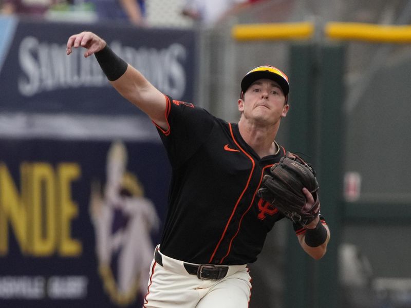 Feb 26, 2024; Scottsdale, Arizona, USA; San Francisco Giants shortstop Tyler Fitzgerald (49) makes the play for an out against the Los Angeles Angels in the first inning at Scottsdale Stadium. Mandatory Credit: Rick Scuteri-USA TODAY Sports