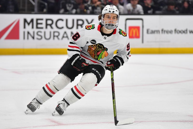 Apr 18, 2024; Los Angeles, California, USA; Chicago Blackhawks center Connor Bedard (98) in action against the Los Angeles Kings during the third period at Crypto.com Arena. Mandatory Credit: Gary A. Vasquez-USA TODAY Sports