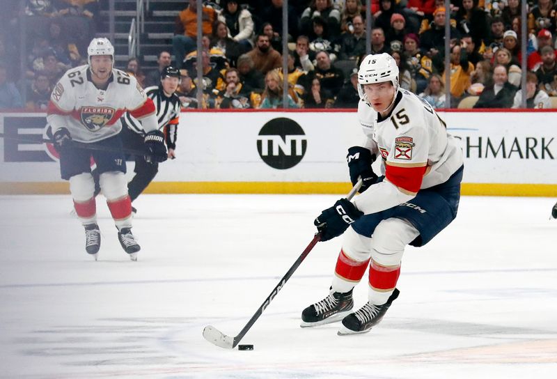 Feb 14, 2024; Pittsburgh, Pennsylvania, USA; Florida Panthers center Anton Lundell (15) skates with the puck against the Pittsburgh Penguins during the second period at PPG Paints Arena. Florida won 5-2.Mandatory Credit: Charles LeClaire-USA TODAY Sports