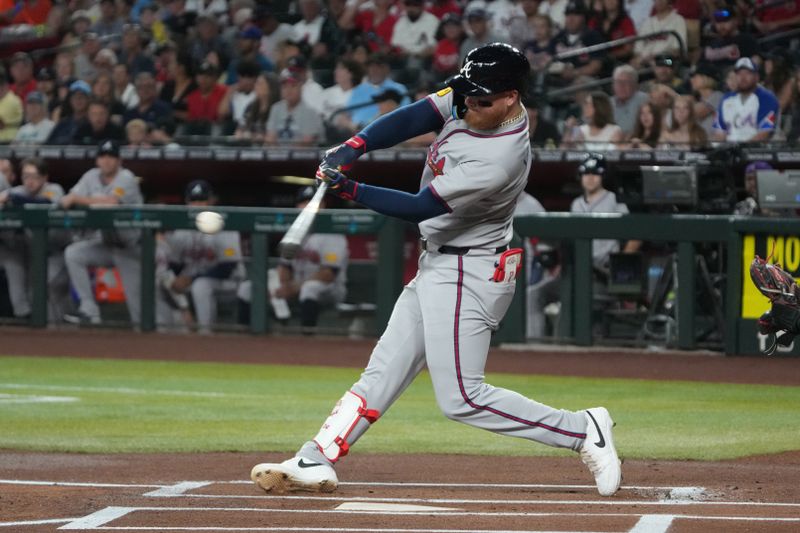 Apr 27, 2025; Phoenix, Arizona, USA; Atlanta Braves outfielder Alex Verdugo (8) hits a single against the Arizona Diamondbacks in the first inning at Chase Field. Mandatory Credit: Rick Scuteri-Imagn Images