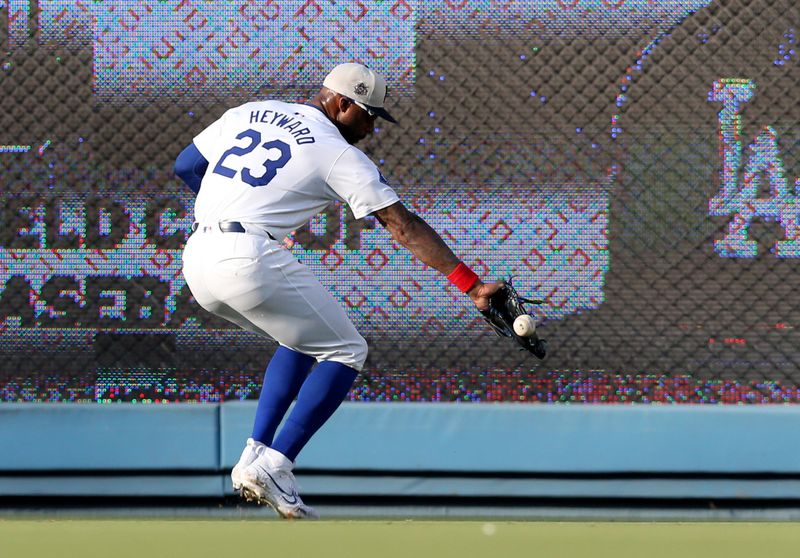 Jul 4, 2024; Los Angeles, California, USA; Los Angeles Dodgers outfielder Jason Heyward (23) plays a ball during the first inning against the Arizona Diamondbacks at Dodger Stadium. Mandatory Credit: Jason Parkhurst-USA TODAY Sports