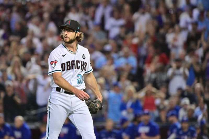 Nov 1, 2023; Phoenix, AZ, USA; Arizona Diamondbacks starting pitcher Zac Gallen (23) returns to the dugout in the sixth inning against the Texas Rangers in game five of the 2023 World Series at Chase Field. Mandatory Credit: Matt Kartozian-USA TODAY Sports